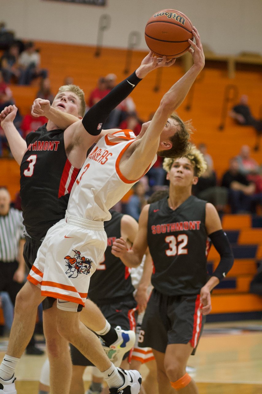 Carson Chadd and Jakob Kirsch battle for a rebound.